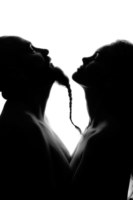 Male and female silhouettes facing each other — the magnetic pull between masculine and feminine